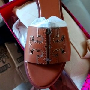 Tory Burch Ines calf tan leather and gold metallic accents.